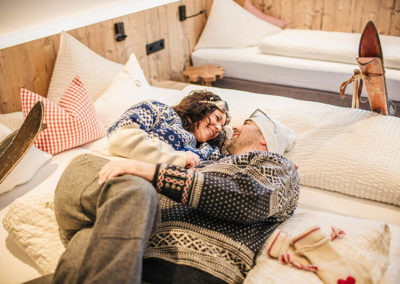 Couple in bed of room of B&B